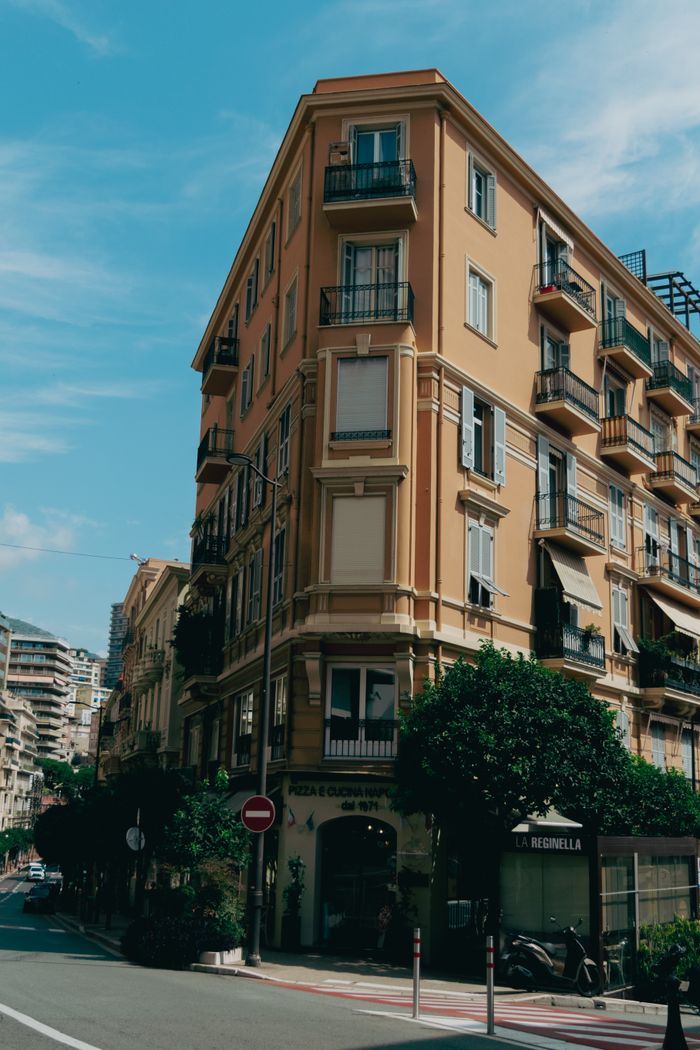 services-04 Beautiful Mediterranean-style building in sunny Monaco showcasing classic elegance.
